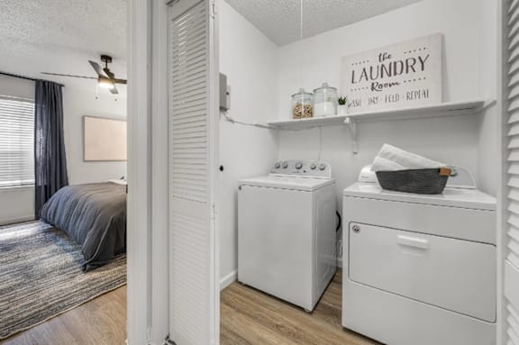A laundry room with a washer and dryer.