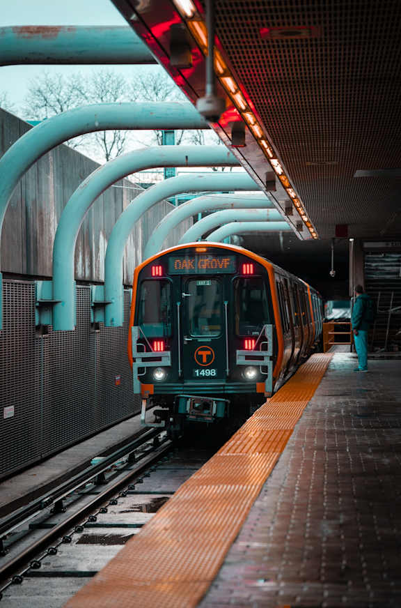 A train with the number 13 on the front is at the station.