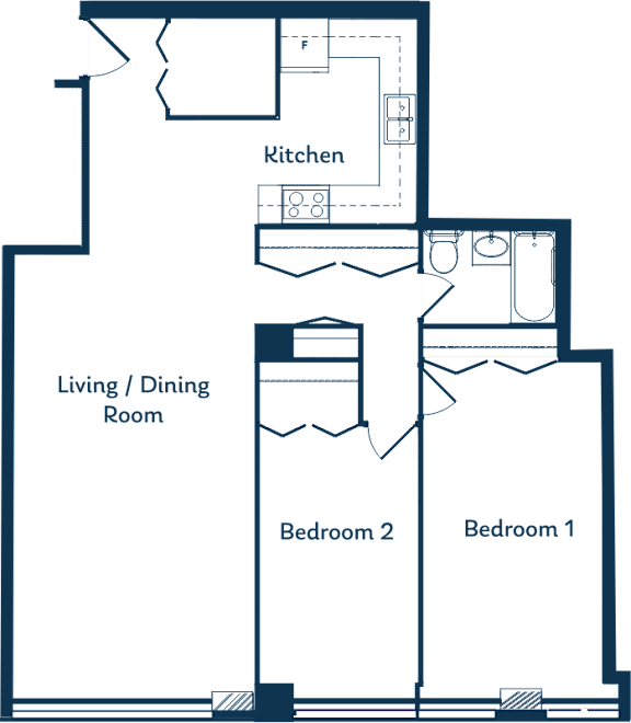A floor plan of a house with a kitchen, living/dining room, and two bedrooms.