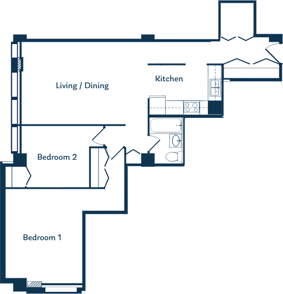 A floor plan of a house with two bedrooms, a living/dining area, and a kitchen.