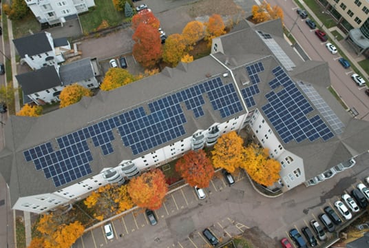 A building with solar panels on the roof.