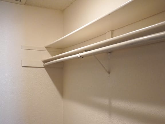 A white wall with a white shelf attached to it at Grand Manor Apartments , Grand Junction, Colorado
