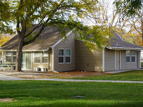 A house with a tree in front of it at Grand Manor Apartments , Colorado