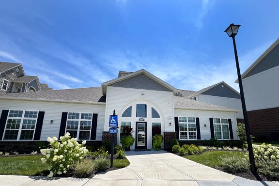 a white building with a blue sign in front of it at Parkway Trails, Kentucky