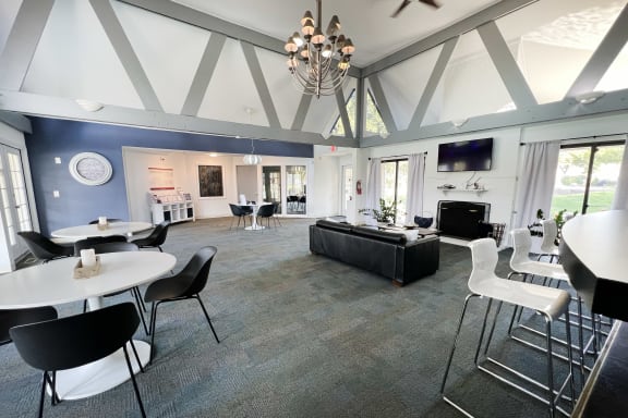 a large living room with tables and chairs and a couch at Miamisburg by the Mall, Ohio