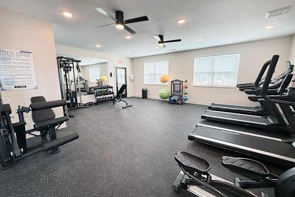 Fitness room with treadmills and cable equipment at The Meridian on 32 Apartments, Ohio