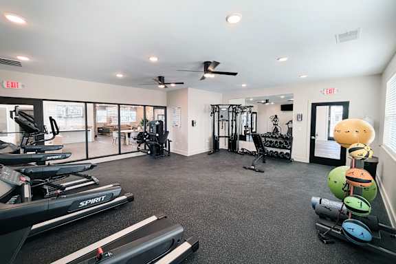Gym with cardio machines and training accessories at The Meridian on 32 Apartments, Batavia, OH 45103