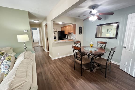 a living room and dining room with a couch and a table  at Fox Run Apartments, Cincinnati, OH, 45236