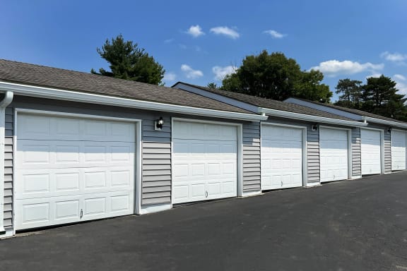 a row of garage doors on the side of a building at Deercross Apartments, Cincinnati, Ohio