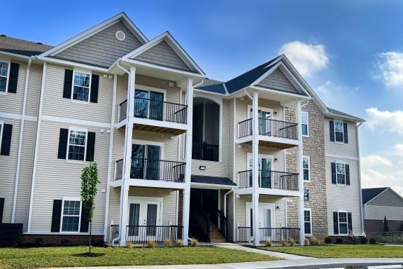 a row of town homes with balconies on a sunny day  at Brookfield Village Apartments, Grove City