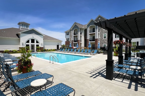 our apartments have a large pool and lounge chairs  at Parkway Trails, Florence, KY