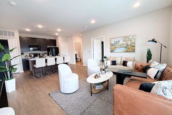 Open floor plan with modern furnishings and hardwood floors at The Meridian on 32 Apartments, Batavia, OH 45103