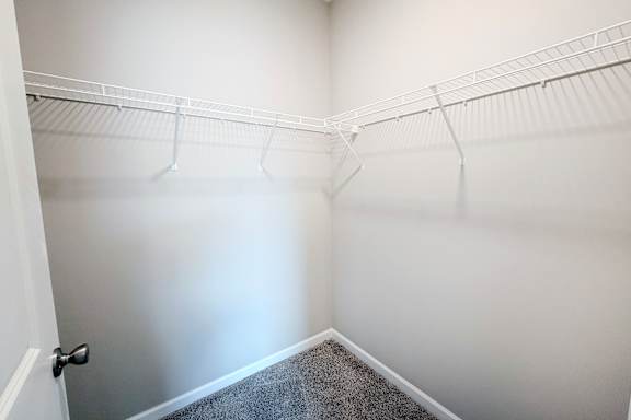Walk-in closet with wire shelving system at The Meridian on 32 Apartments, Batavia, Ohio