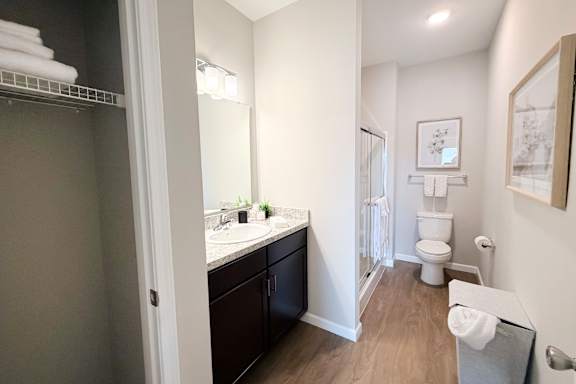 Full bathroom with separate vanity area and shower at The Meridian on 32 Apartments, Ohio