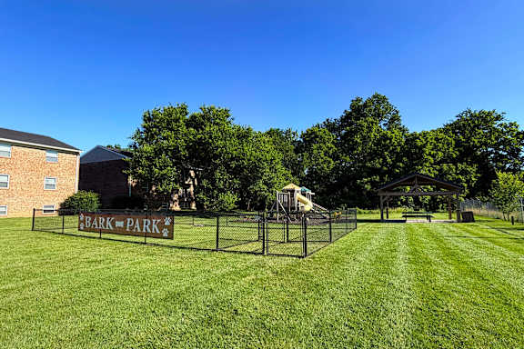 A park with a sign that says Bark Park.
