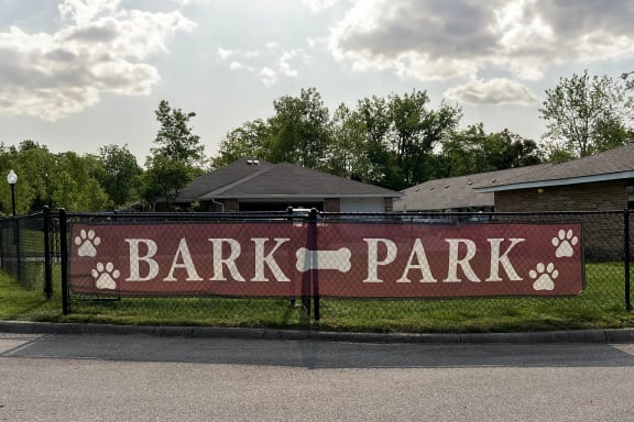 a sign that says bark park in front of houses  at Wyndemere Apartments, Franklin, OH, 45005