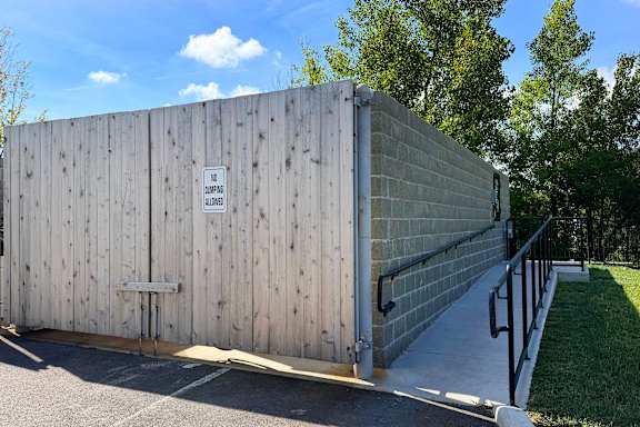 A wooden fence with a sign on it.