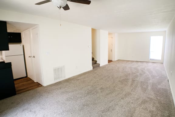 an empty living room with a rug and a ceiling fan at Miamisburg by the Mall, Miamisburg, 45342