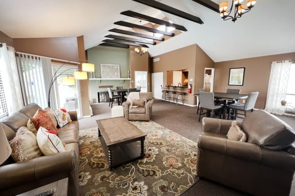 a living room with couches chairs and a coffee table  at Hunter's Creek Apartments, Cincinnati, OH, 45242