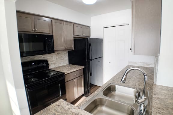 Efficient Appliances In Kitchen  at Steeplechase Apartments, Loveland