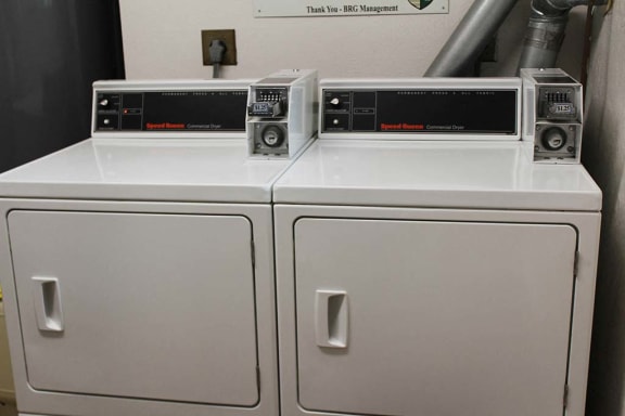 a washer and dryer sitting next to each other at Hunter Ridge Apartments, Ohio
