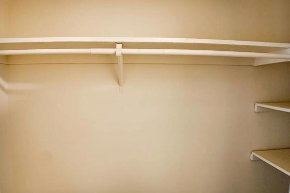 Empty white shelves in a room.