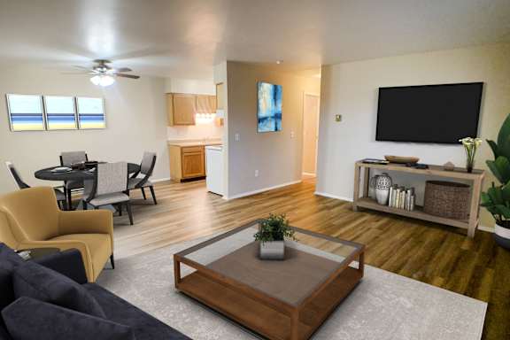 A living room with a brown coffee table and a grey rug.