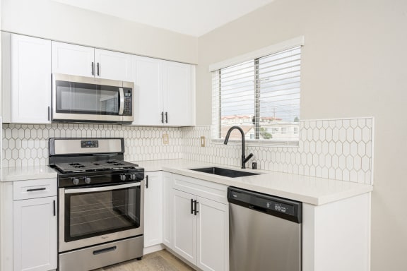 535 N. Hobart Apartments kitchen area with appliances, cabinets, and counters