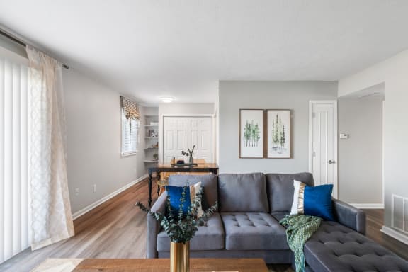 an open living room and dining room with a couch and a table