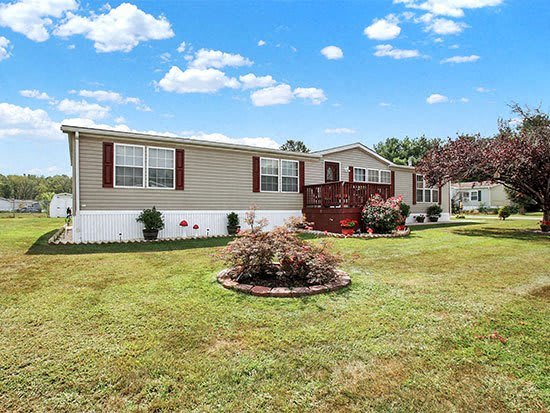 a house with a yard and a red porch