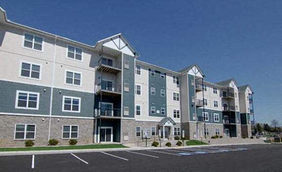 an apartment building with a parking lot