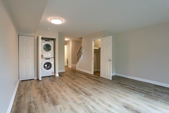 A laundry room with a washer and dryer in it.