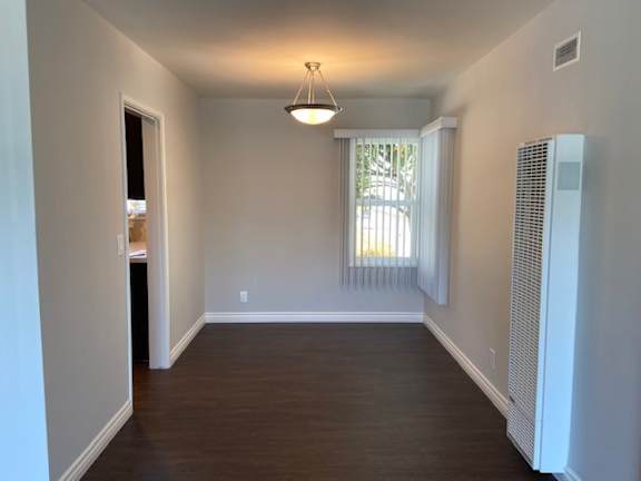 Dedicated Dinning Area with hardwood laminate flooring.
