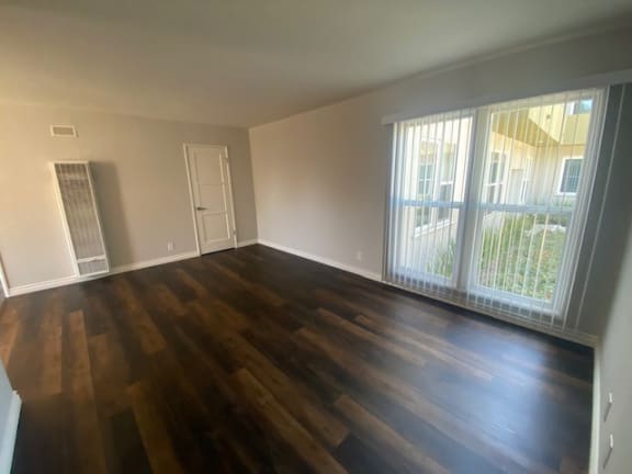 Bright large Living room with vinyl wood flooring