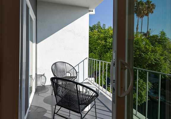 a view of the balcony from the door of a hotel room at 8535 Colgate-Fully Furnished Apartments, Los Angeles, CA