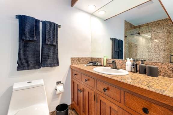 a bathroom with a sink and a toilet and a mirror at 8535 Colgate-Fully Furnished Apartments, California