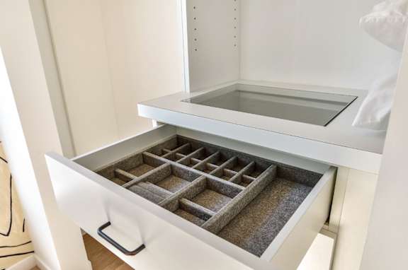 an open drawer in a wardrobe with a glass top at 8535 Colgate-Fully Furnished Apartments, Los Angeles, California