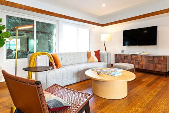 a living room with a couch and a table at 8535 Colgate-Fully Furnished Apartments, Los Angeles, CA