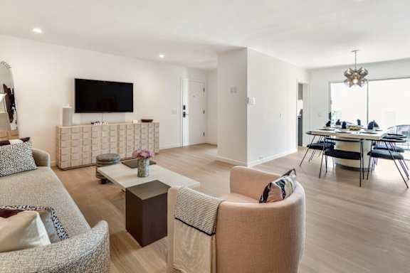 a living room and dining room with a table and chairs at 8535 Colgate-Fully Furnished Apartments, Los Angeles, 90048