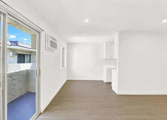 A room with a window and a door leading outside at Bonnie Brae Apartments, Los Angeles