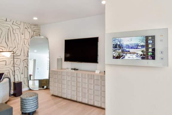 a living room with a television on the wall at 8535 Colgate-Fully Furnished Apartments, California, 90048