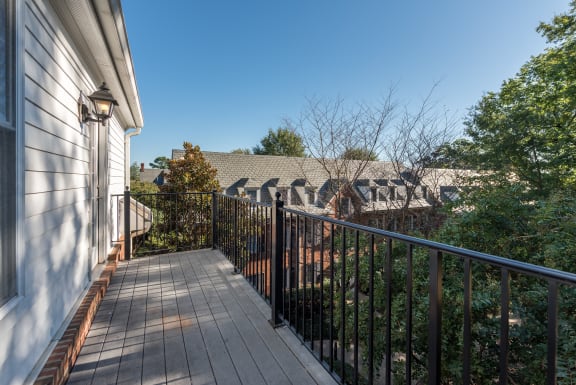 the deck has a view of the neighborhood and the house