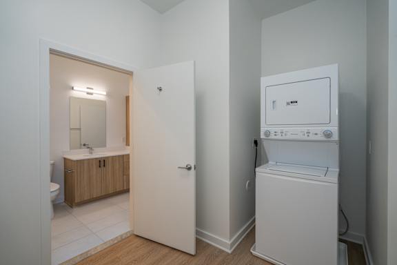 A3 Stackable Washer/Dryer located in Walk In Closet that Connects to Bathroom and Bedroom