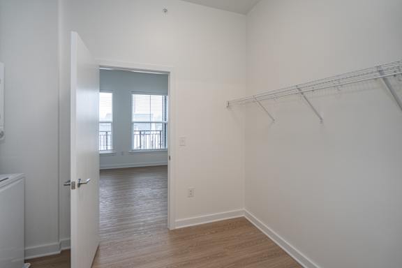 A3 Walk Through Closet with Stackable Washer/Dryer and LVP Flooring