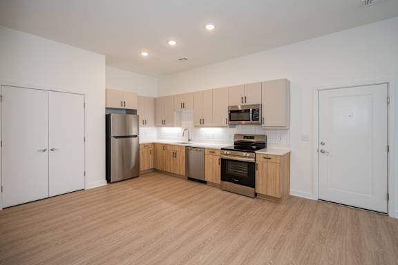 A3 Kitchen with LVP Floors, Stainless Appliances and Two Tone Cabinetry