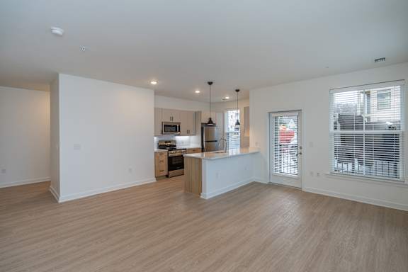 Open kitchen and living room with access to patio/balcony