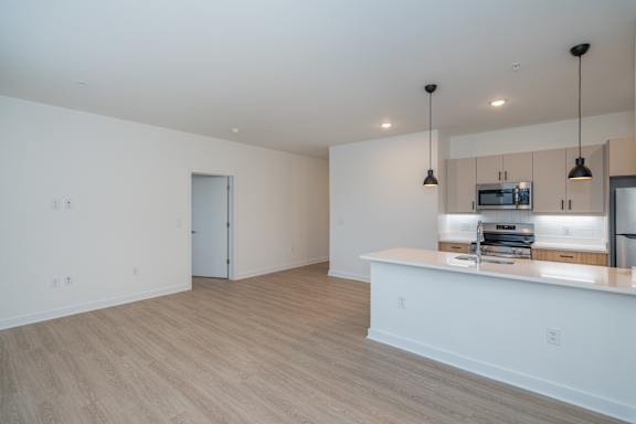 Additional view of the open living room and kitchen area