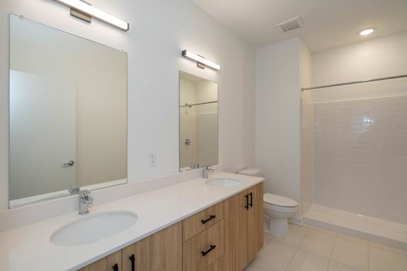 Primary bathroom with ample counterspace and storage