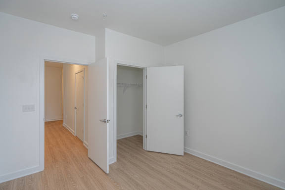 Second bedroom with large closet and LVP flooring