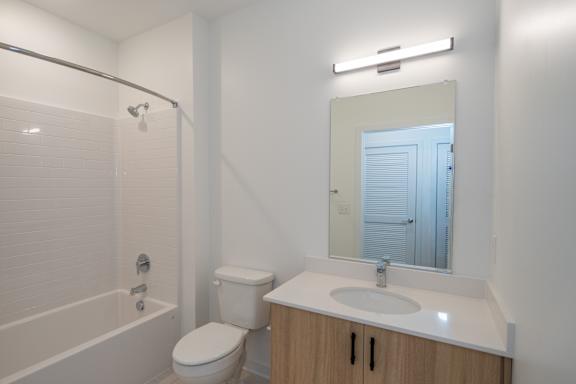 Second bathroom with bathtub and tile flooring